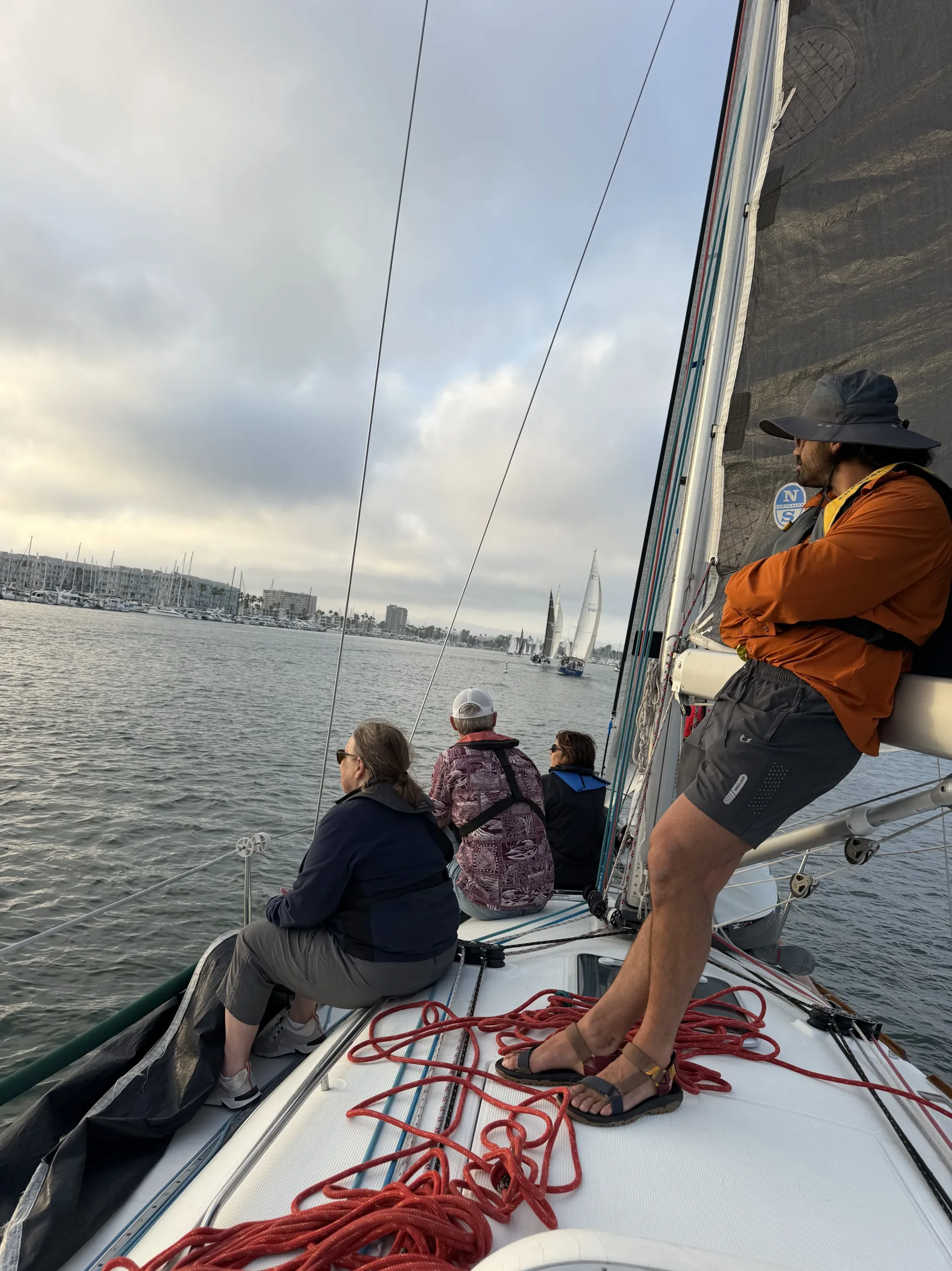 Sailors aboard a racing yacht in Marina del Rey